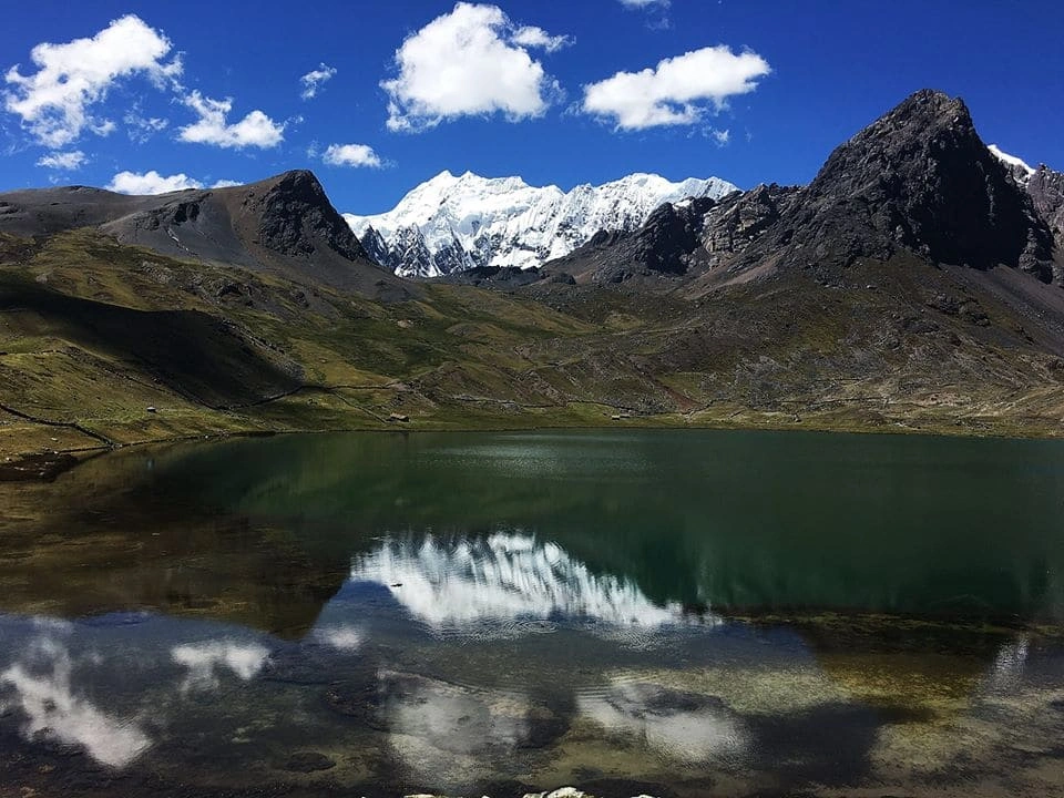 Mountain lake and Apu Ausangate near Paqcchanta, Peru
