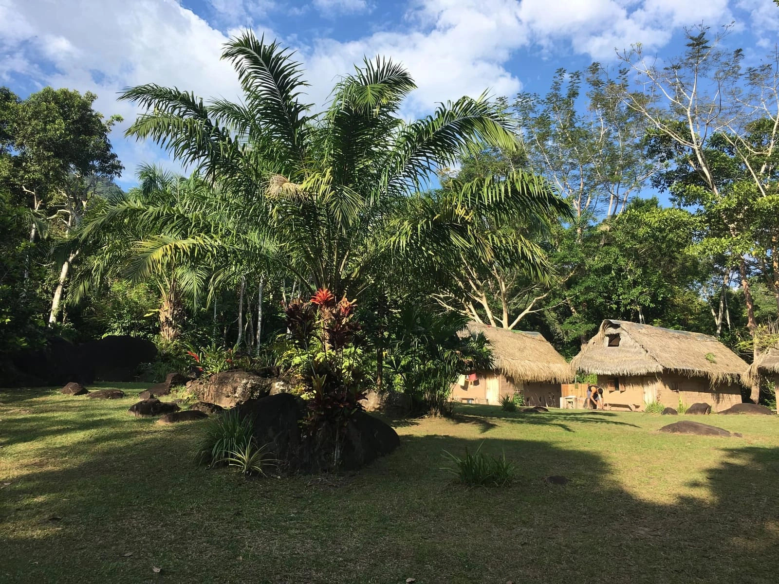 Thatched retreat buildings and gardens at Nova Terra near Tarapoto